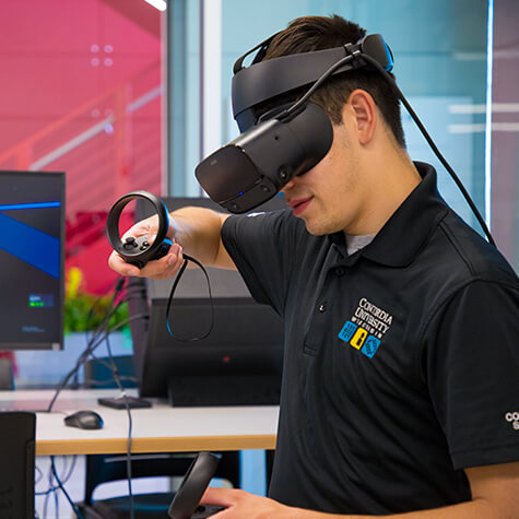 A computer science student tests out a virtual reality headset in Concordia’s Makerspace.