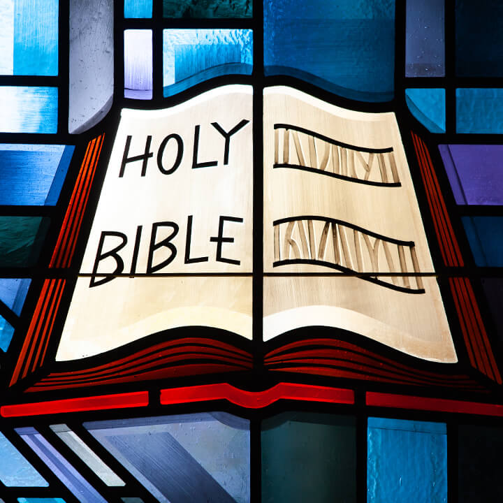 Stained glass depicting the Holy Bible taken in the Chapel of Christ Triumphant.