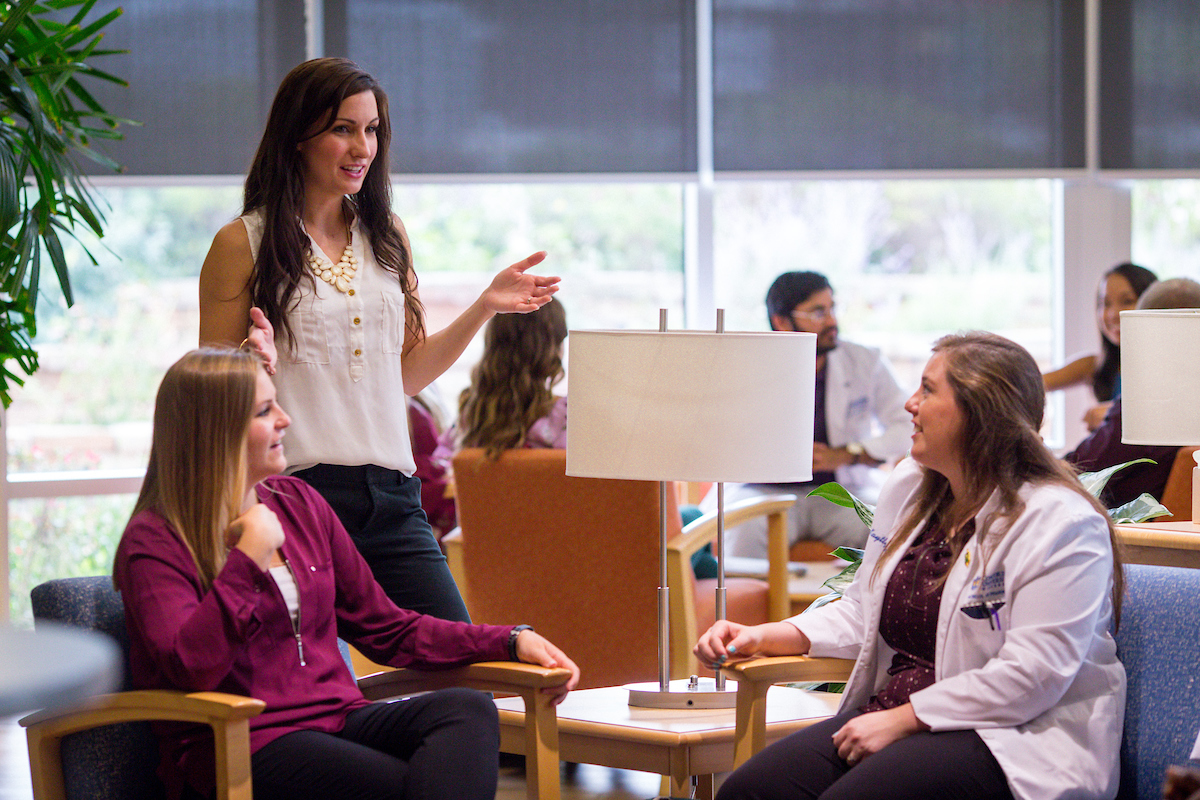 Students talking in the SOP entry way